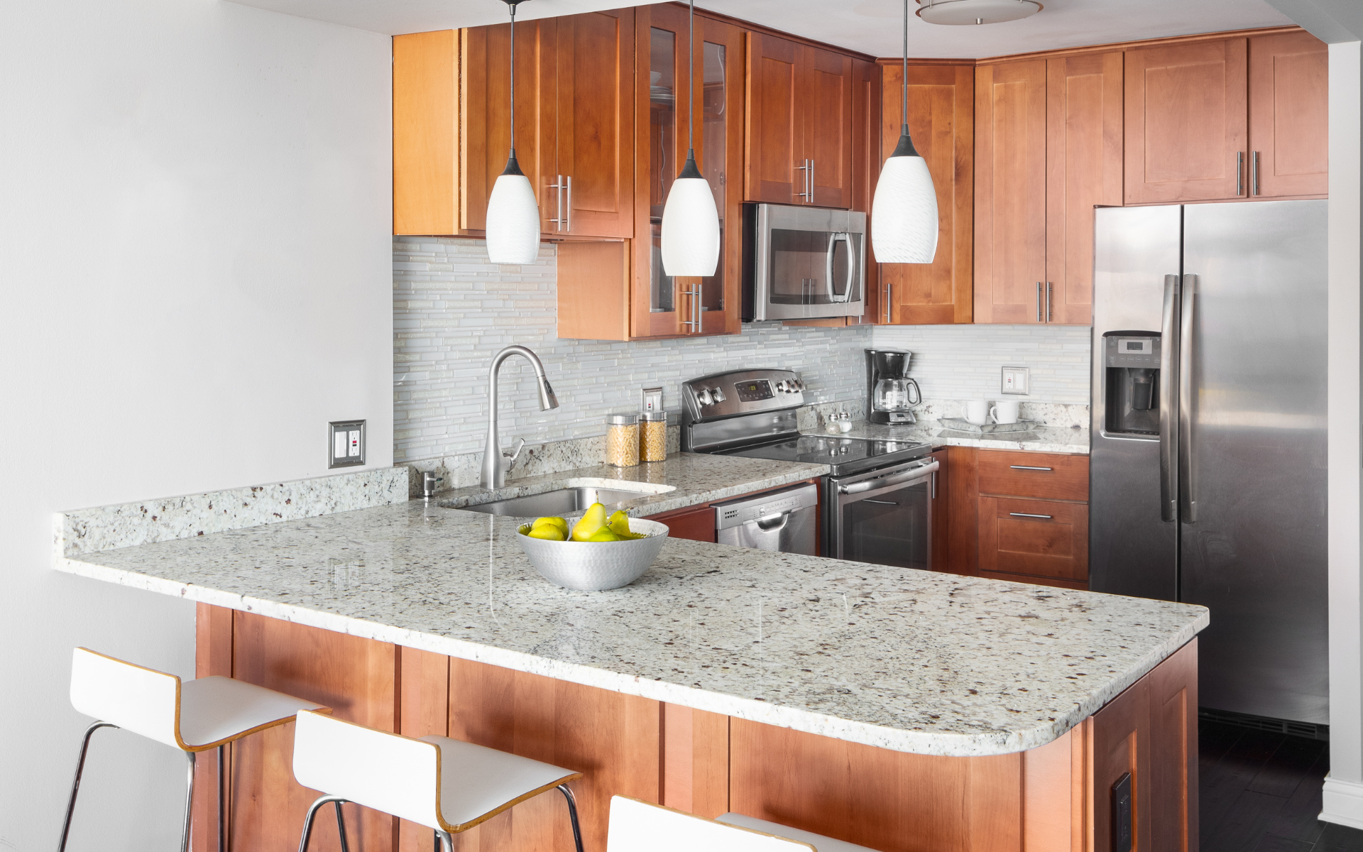 Small kitchen with brown cabinets and white countertop