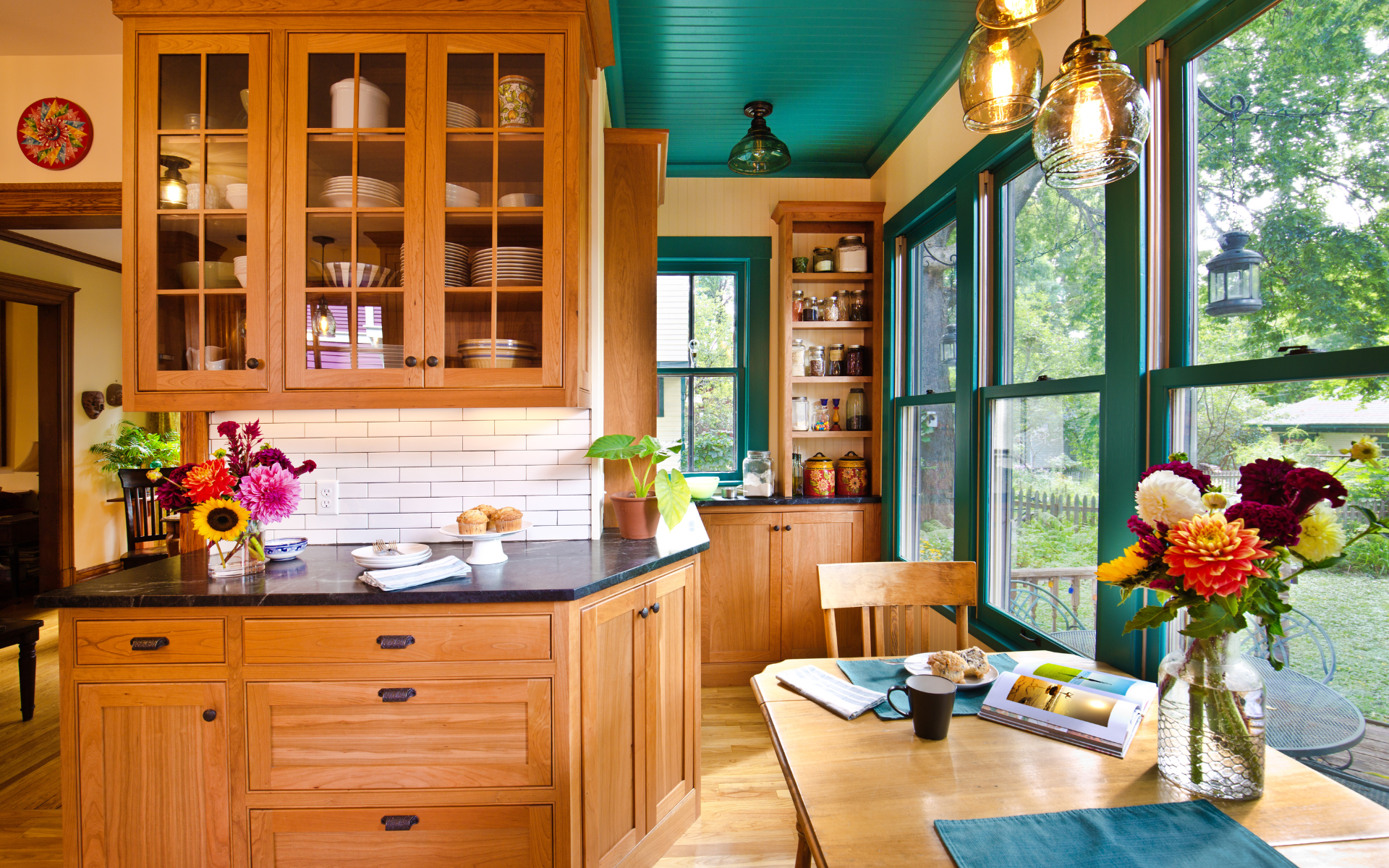 Brown kitchen with glass front cabinets