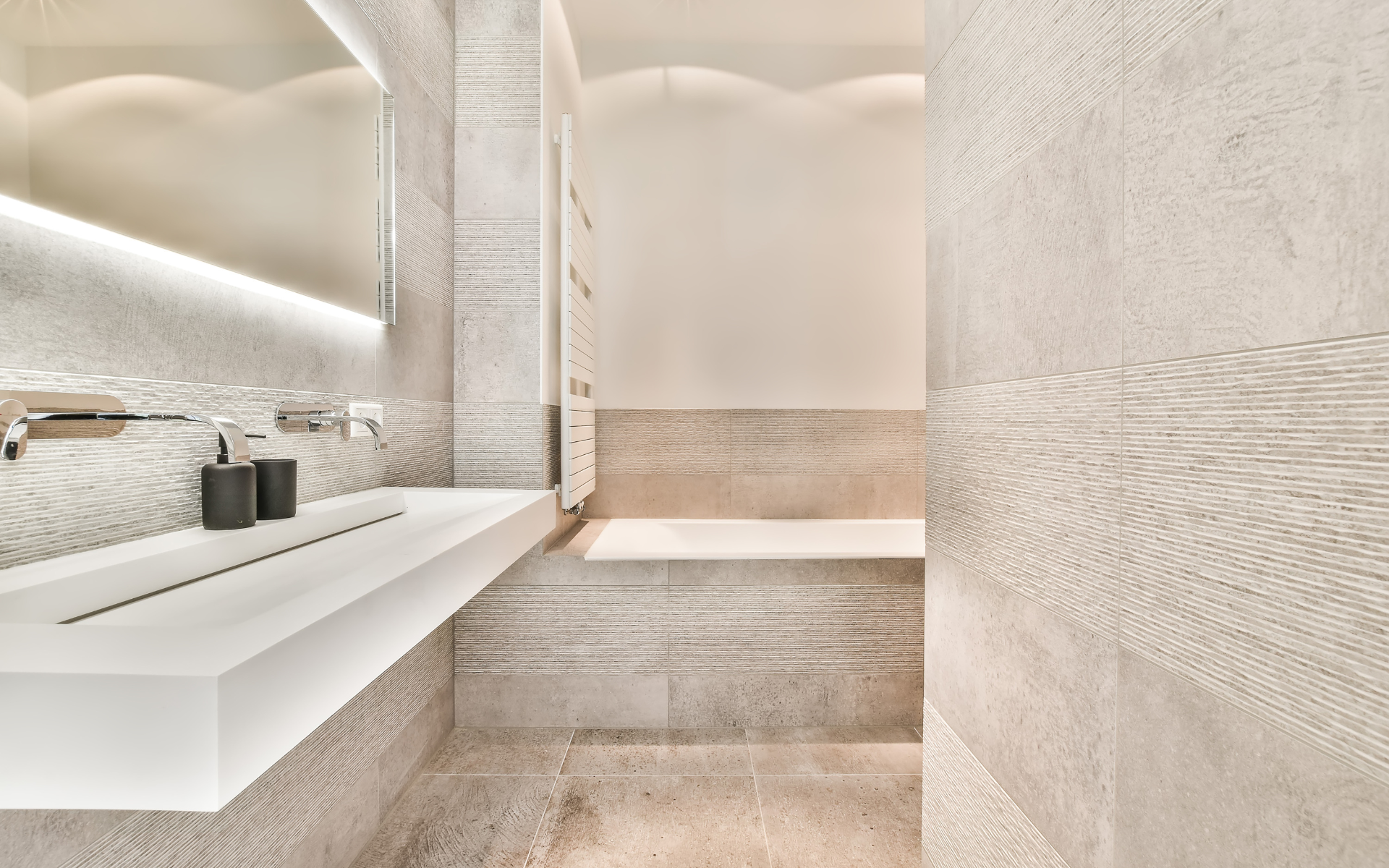 Modern style bathroom with floating sink, and tub